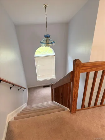 a view of a hallway with windows