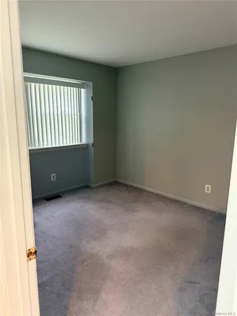 an empty room with closet area
