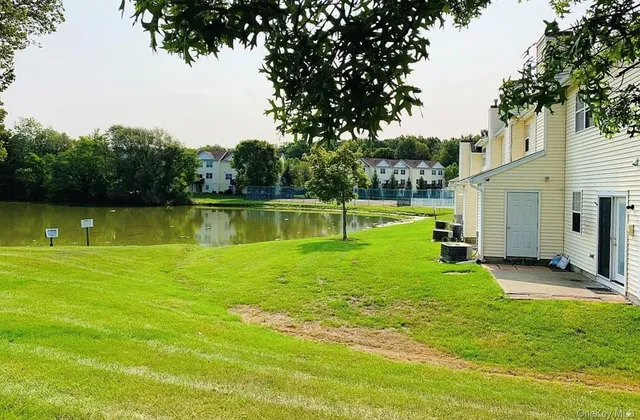 a view of a swimming pool with a yard