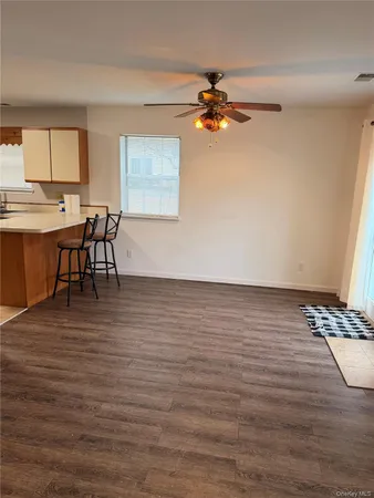 a view of room with wooden floor
