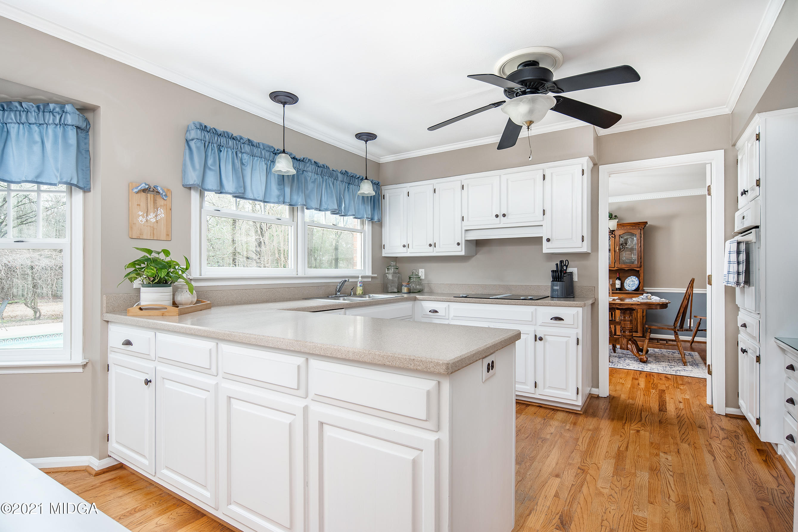 155 Castlegate Road Macon, GA 31210 - Photo 15 of 34 a kitchen with granite countertop a sink cabinets stainless steel appliances and a window