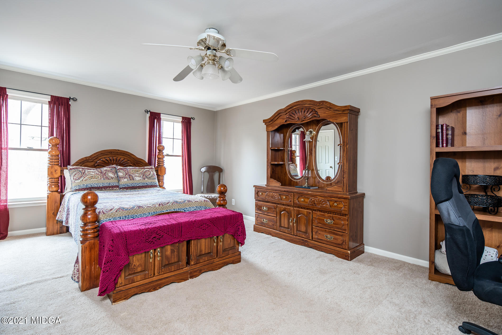 155 Castlegate Road Macon, GA 31210 - Photo 24 of 34 a bedroom with a bed and a dresser in it