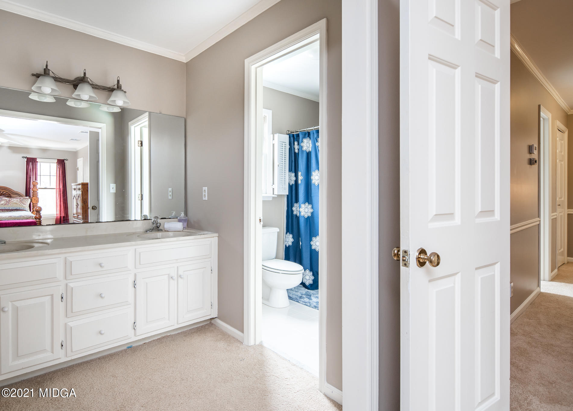155 Castlegate Road Macon, GA 31210 - Photo 25 of 34 a en suite bathroom with a granite countertop sink and a mirror
