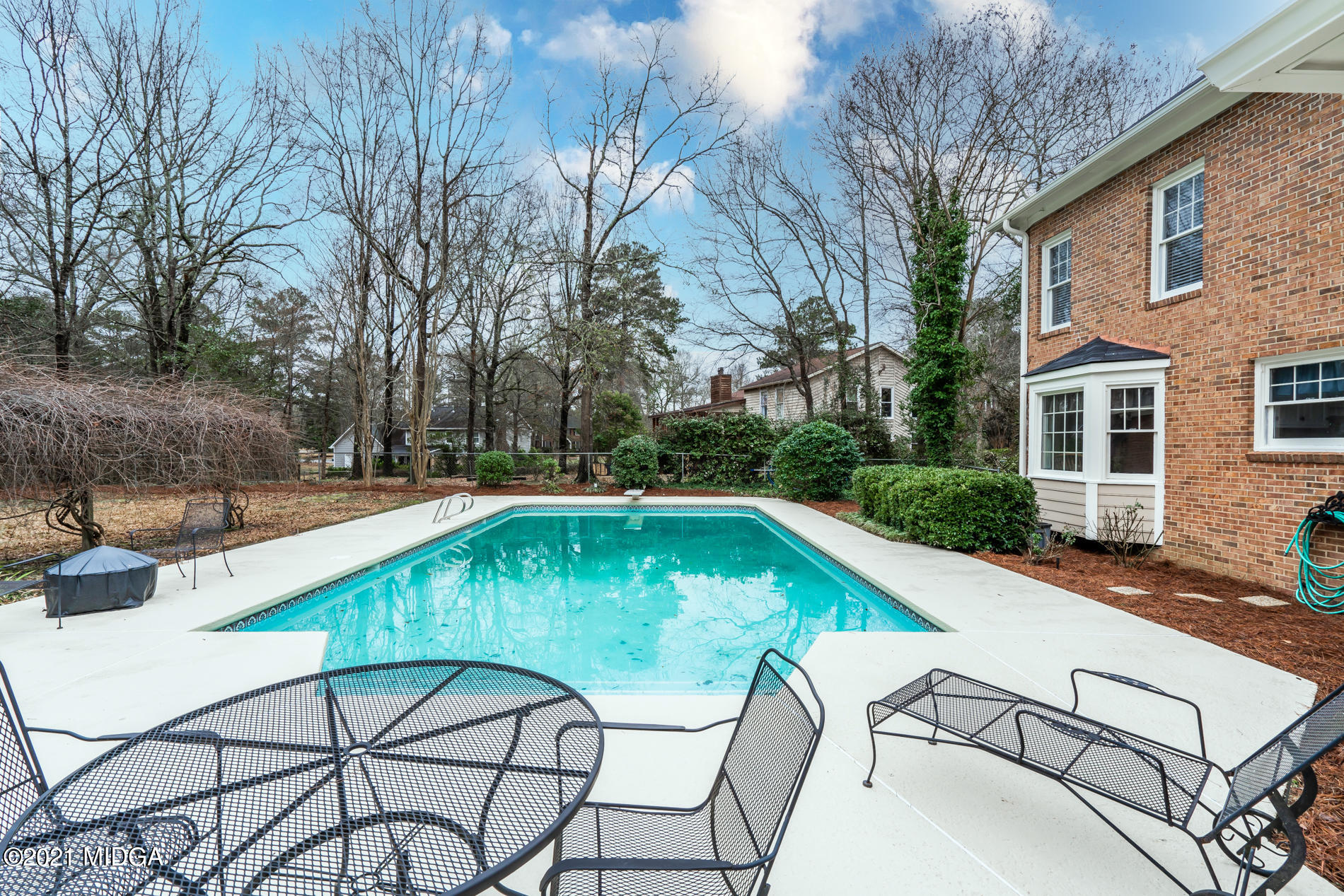 155 Castlegate Road Macon, GA 31210 - Photo 31 of 34 a view of a swimming pool with a patio