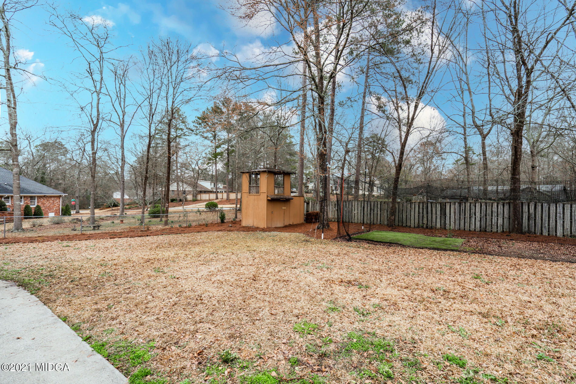 155 Castlegate Road Macon, GA 31210 - Photo 32 of 34 a house with trees in front of it