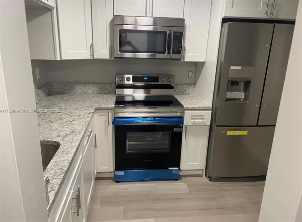 a bathroom with a toilet a sink and bathtub