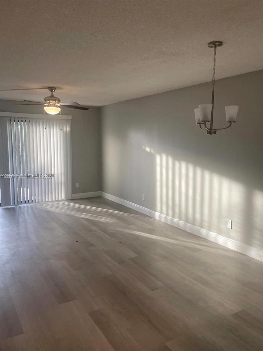 3252 Foxcroft Road, Unit 314 Miramar, FL 33025 - Photo 6 of 9 a view of an empty room with a window