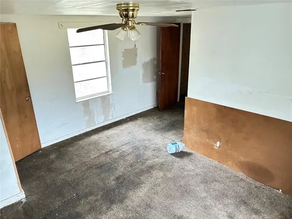 a view of a hallway with closet