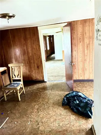 an empty room with wooden floor and closet