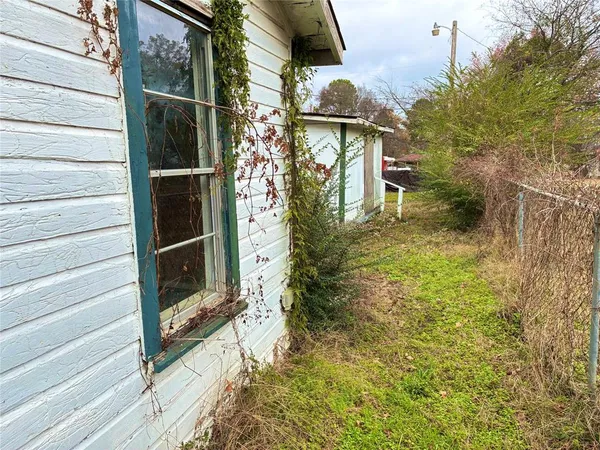 a partial view of a house with a yard