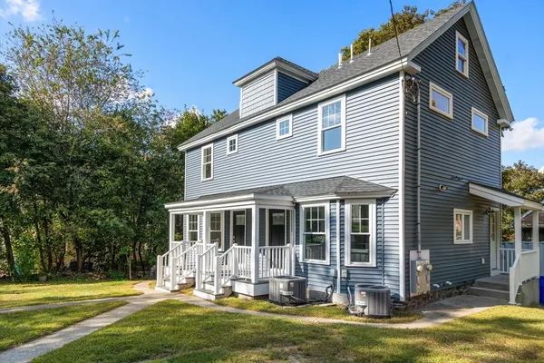 a front view of a house with a yard