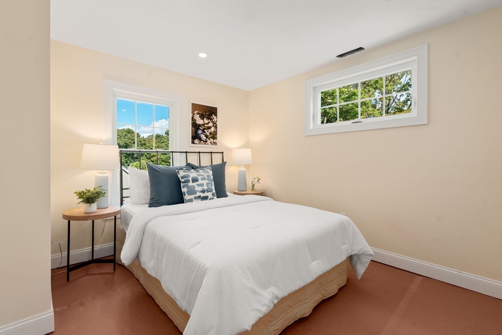 28 Waltham Street, Unit B Maynard, MA 01754 - Photo 12 of 17 a bedroom with a bed and a window