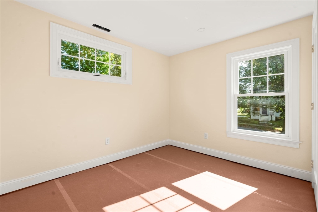 28 Waltham Street, Unit B Maynard, MA 01754 - Photo 13 of 17 an empty room with windows