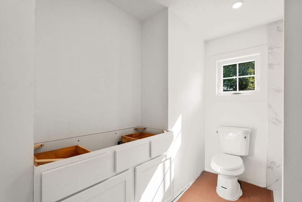 28 Waltham Street, Unit B Maynard, MA 01754 - Photo 14 of 17 a bathroom with a toilet and a sink