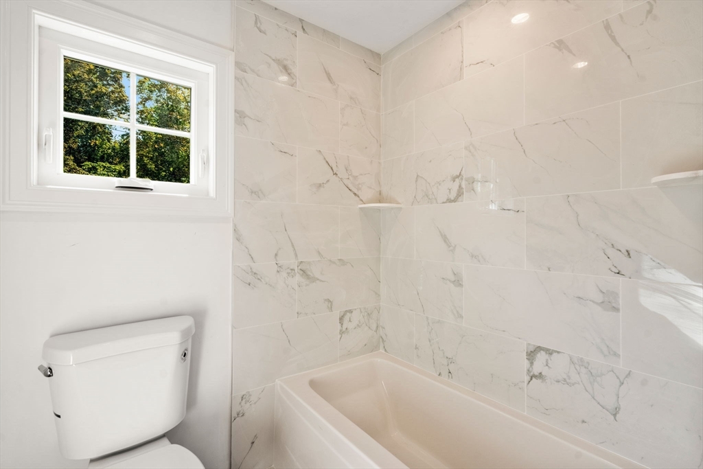 28 Waltham Street, Unit B Maynard, MA 01754 - Photo 15 of 17 a bathroom with a toilet and a bathtub