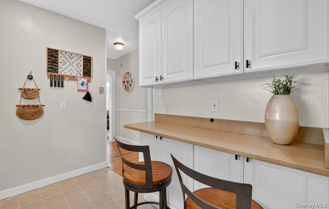 34 Ridge Road Croton-on-Hudson, NY 10520 - Photo 18 of 35 Bar area featuring white cabinets and light countertops