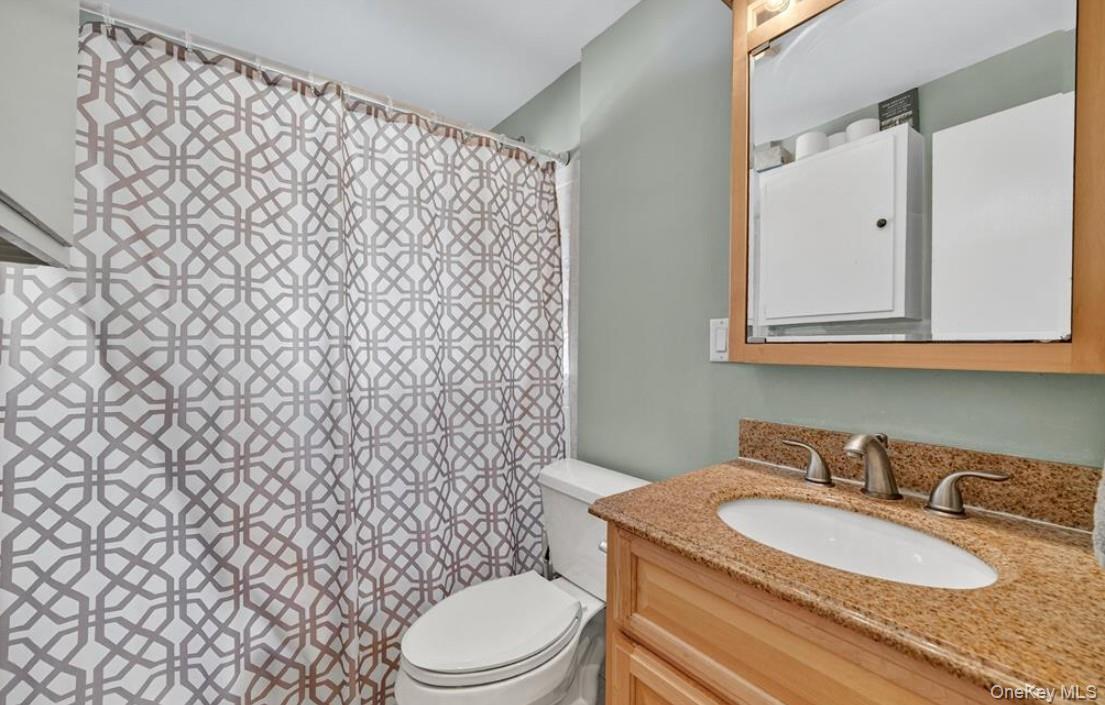 34 Ridge Road Croton-on-Hudson, NY 10520 - Photo 20 of 35 The first level full bath with vanity, and tub/shower