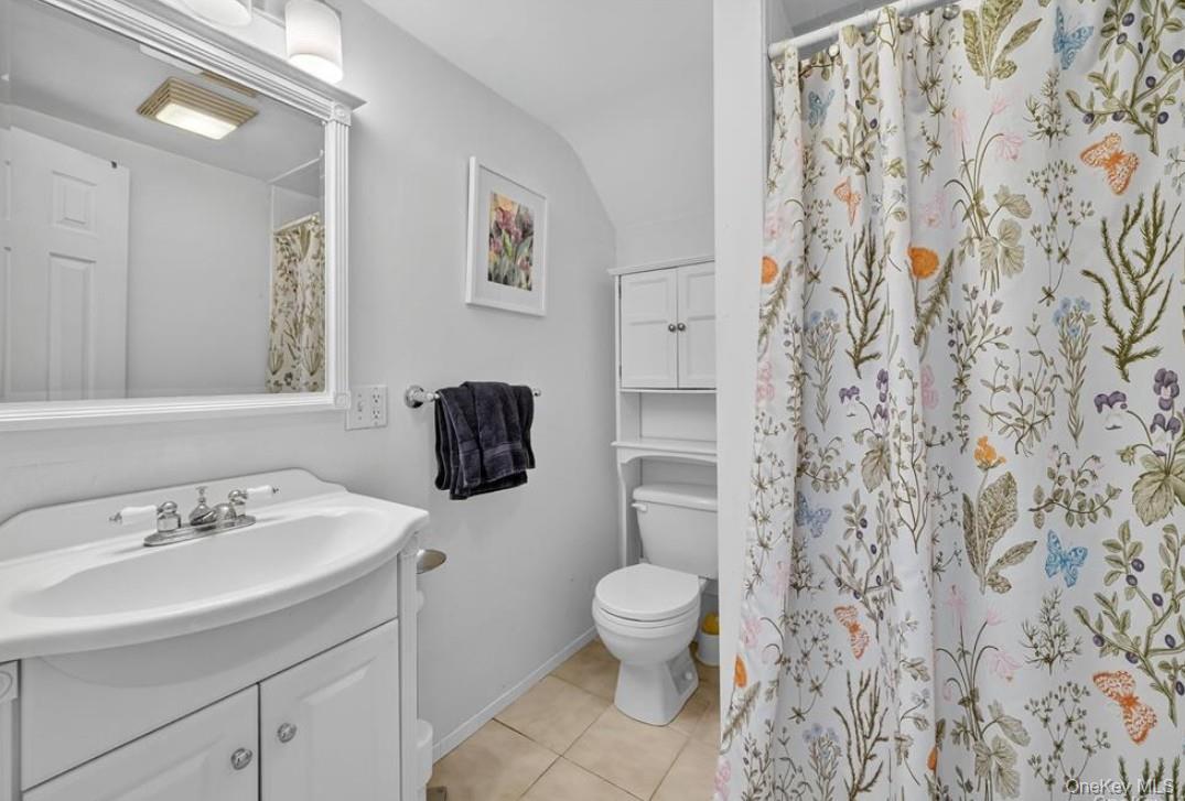 34 Ridge Road Croton-on-Hudson, NY 10520 - Photo 26 of 35 Bathroom featuring walk in shower, vanity, and light tile patterned flooring