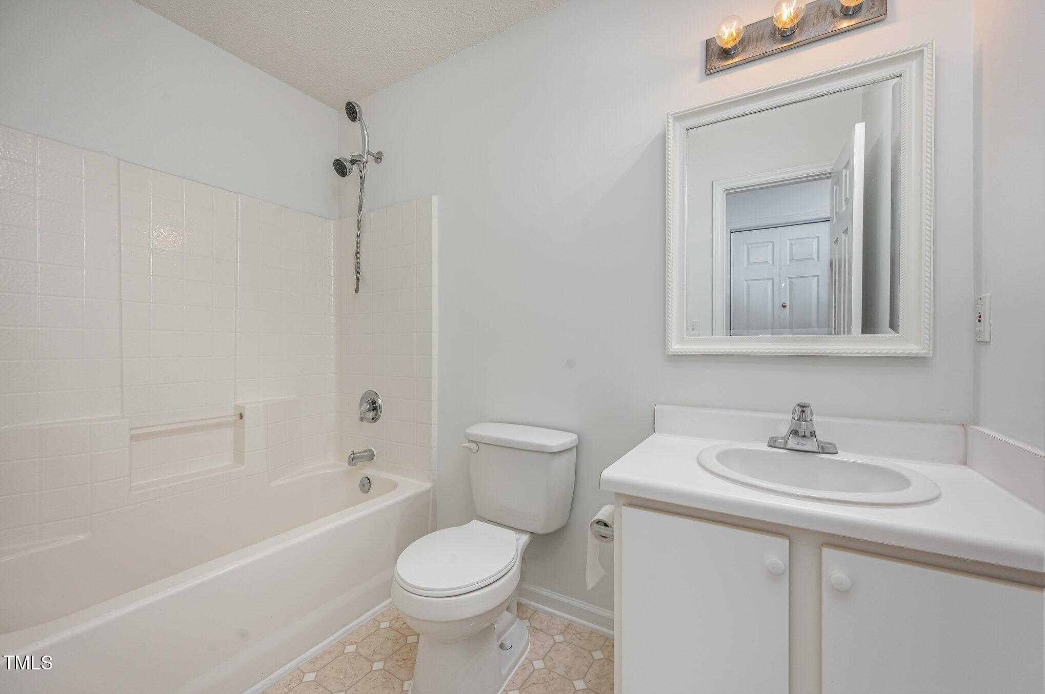102 Checker Court Apex, NC 27502 - Photo 11 of 15 a bathroom with a sink toilet and shower