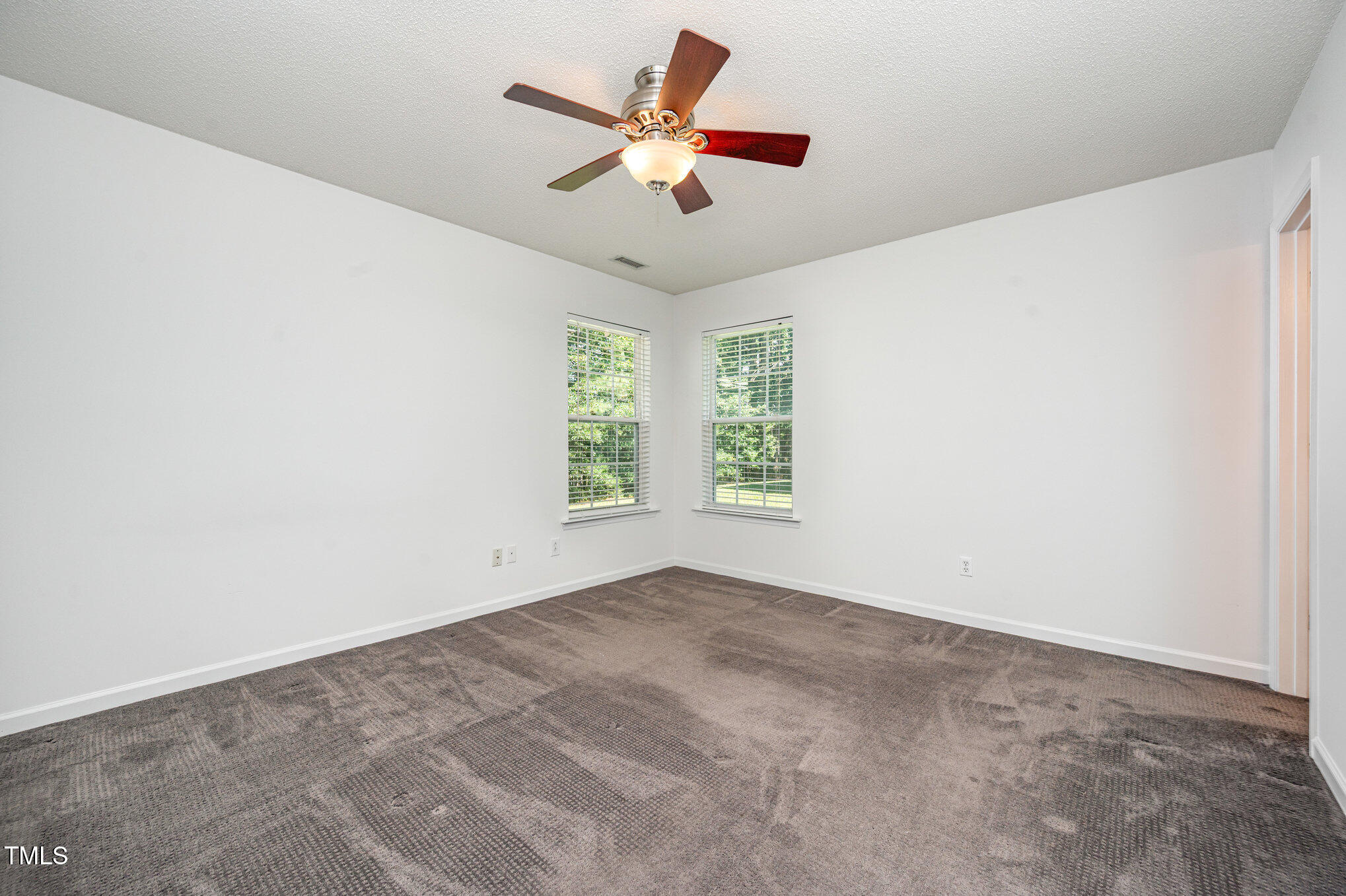 102 Checker Court Apex, NC 27502 - Photo 8 of 15 an empty room with a window