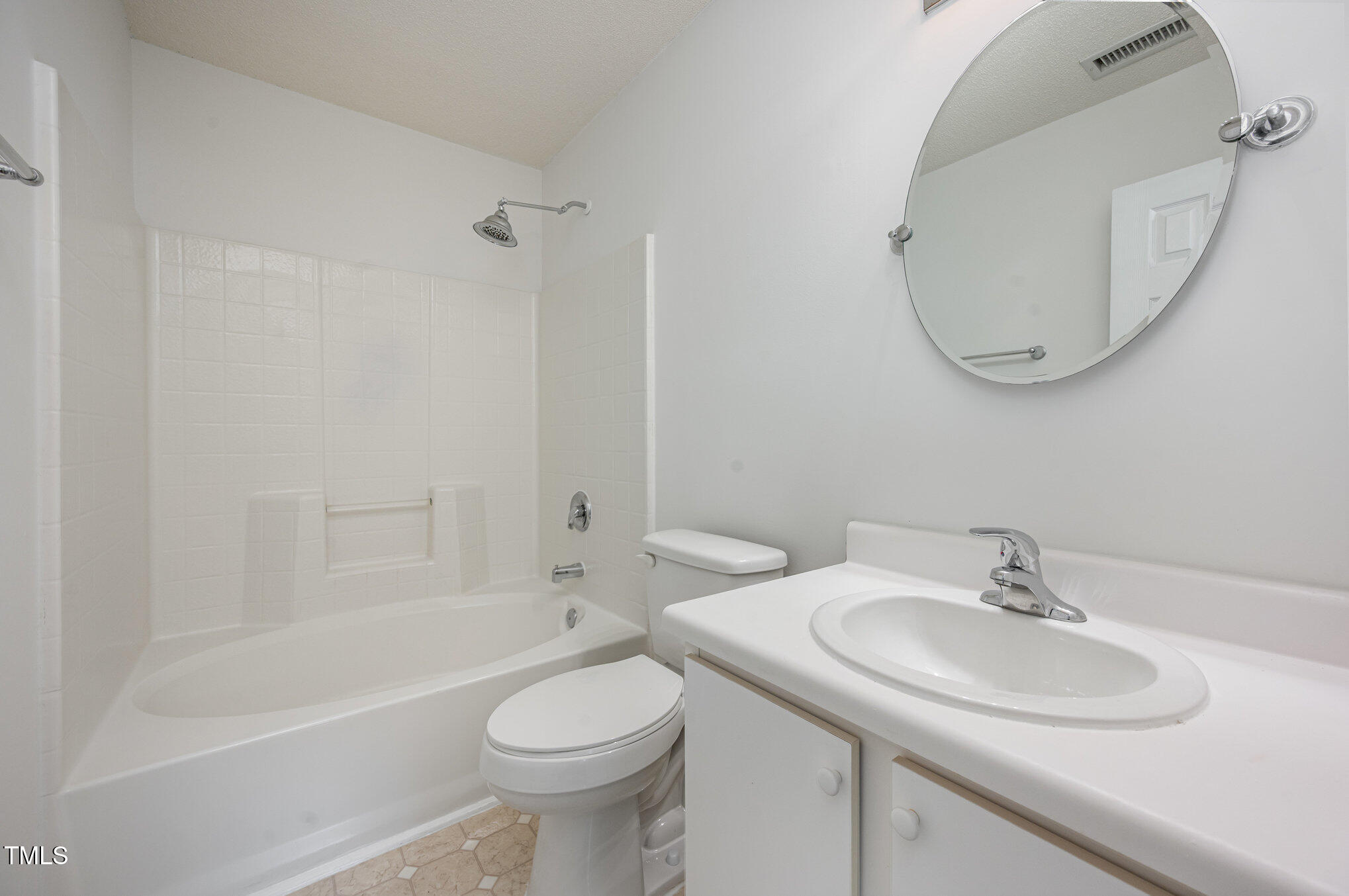 102 Checker Court Apex, NC 27502 - Photo 9 of 15 a bathroom with a sink a toilet and a mirror