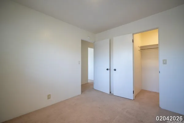 a view of an empty room and a window