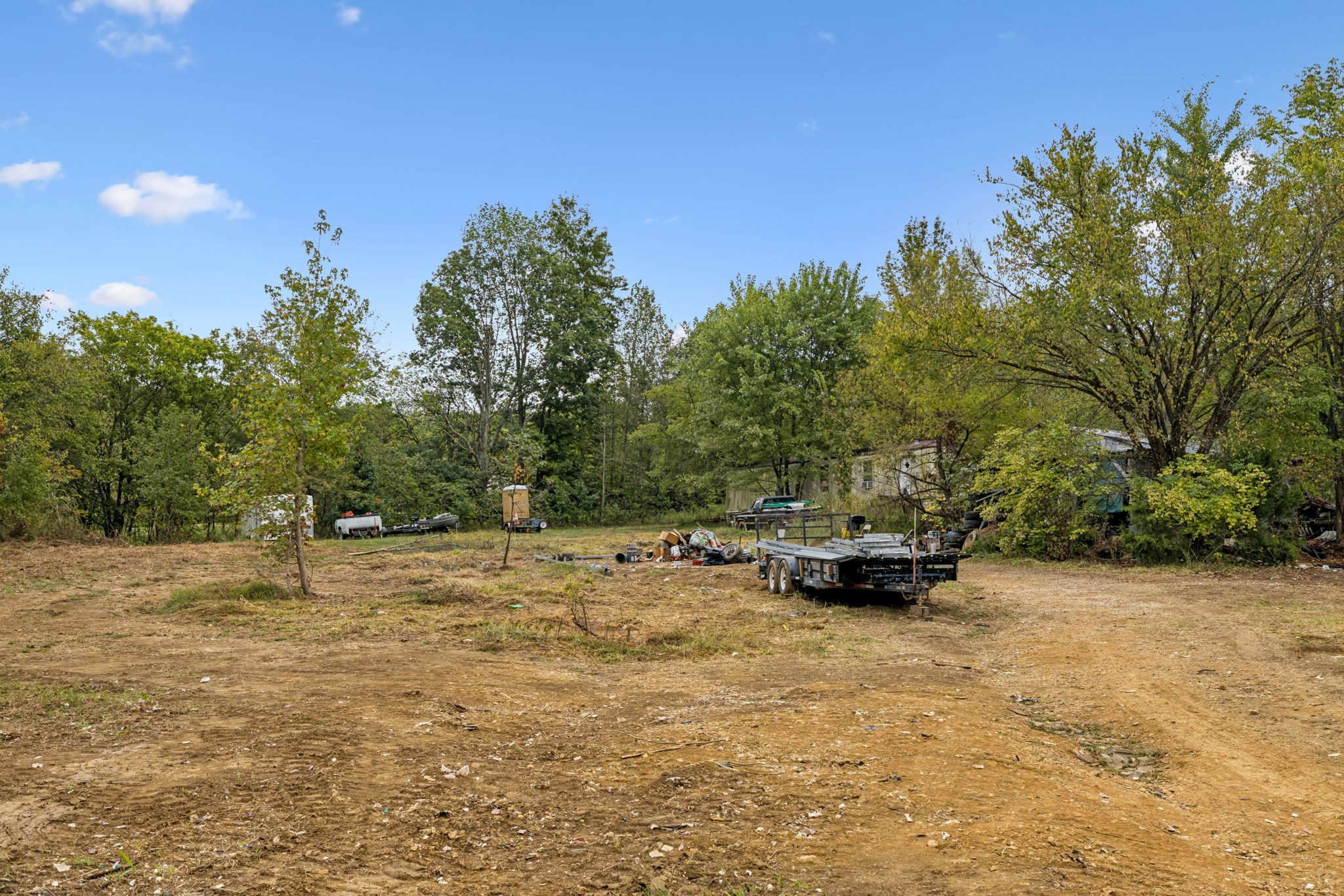 7452 Chowning Road Springfield, TN 37172 - Photo 3 of 27 a view of a backyard with a car parked on the road