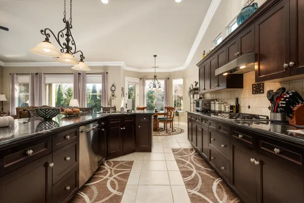a large kitchen with lots of counter space and a sink