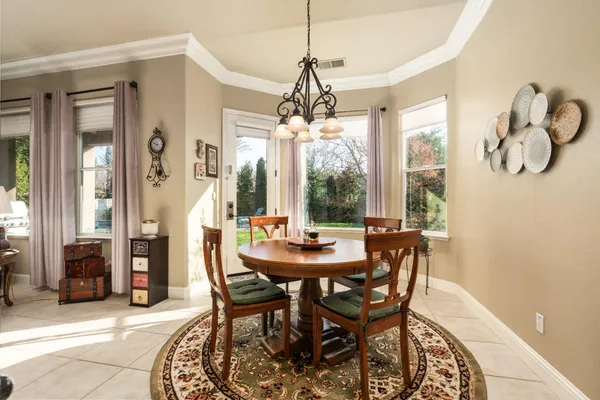 a dining room with furniture and window