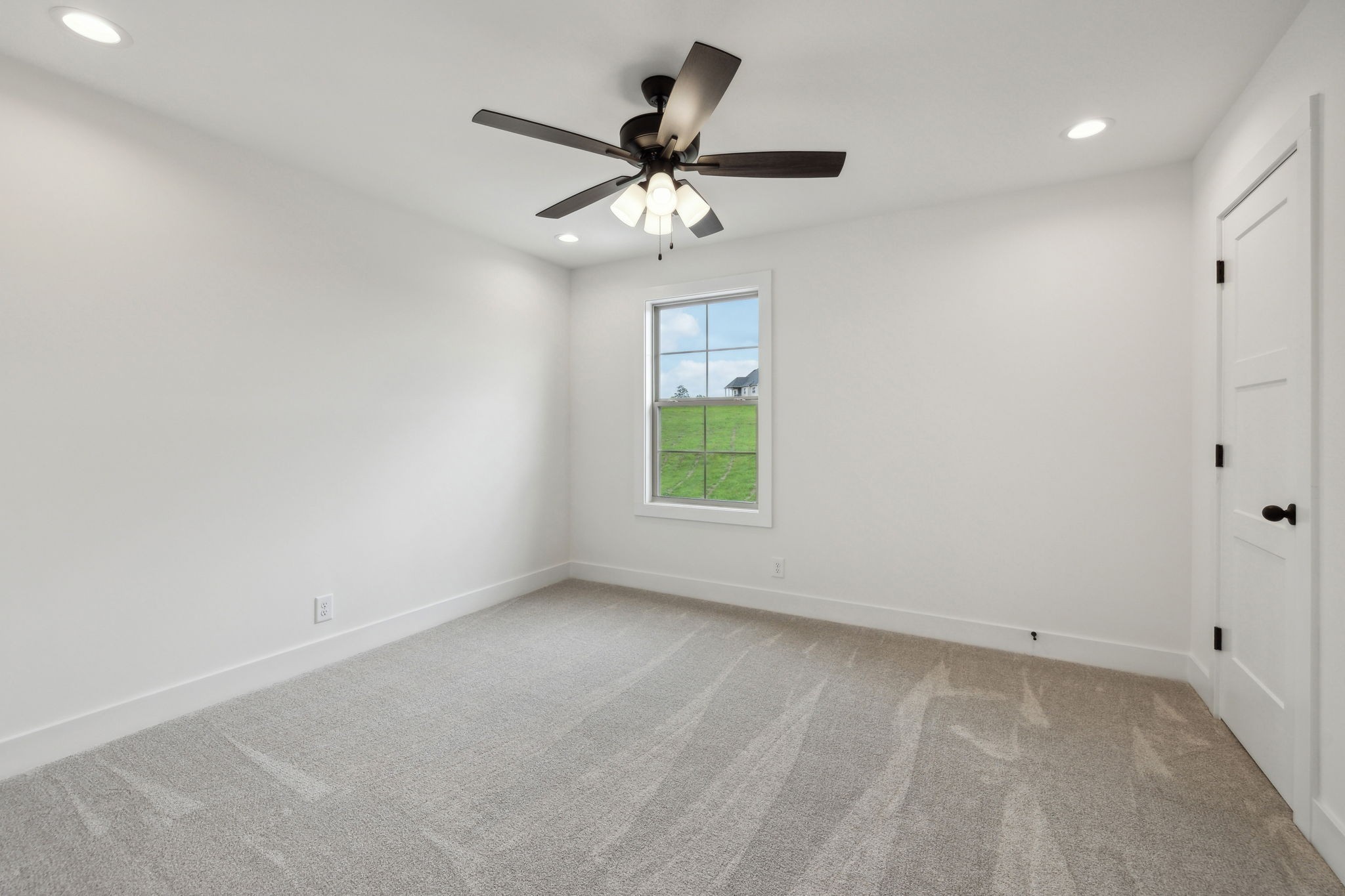 1075 Linder Ridge Road Indian Mound, TN 37079 - Photo 21 of 29 an empty room with a window and a fan