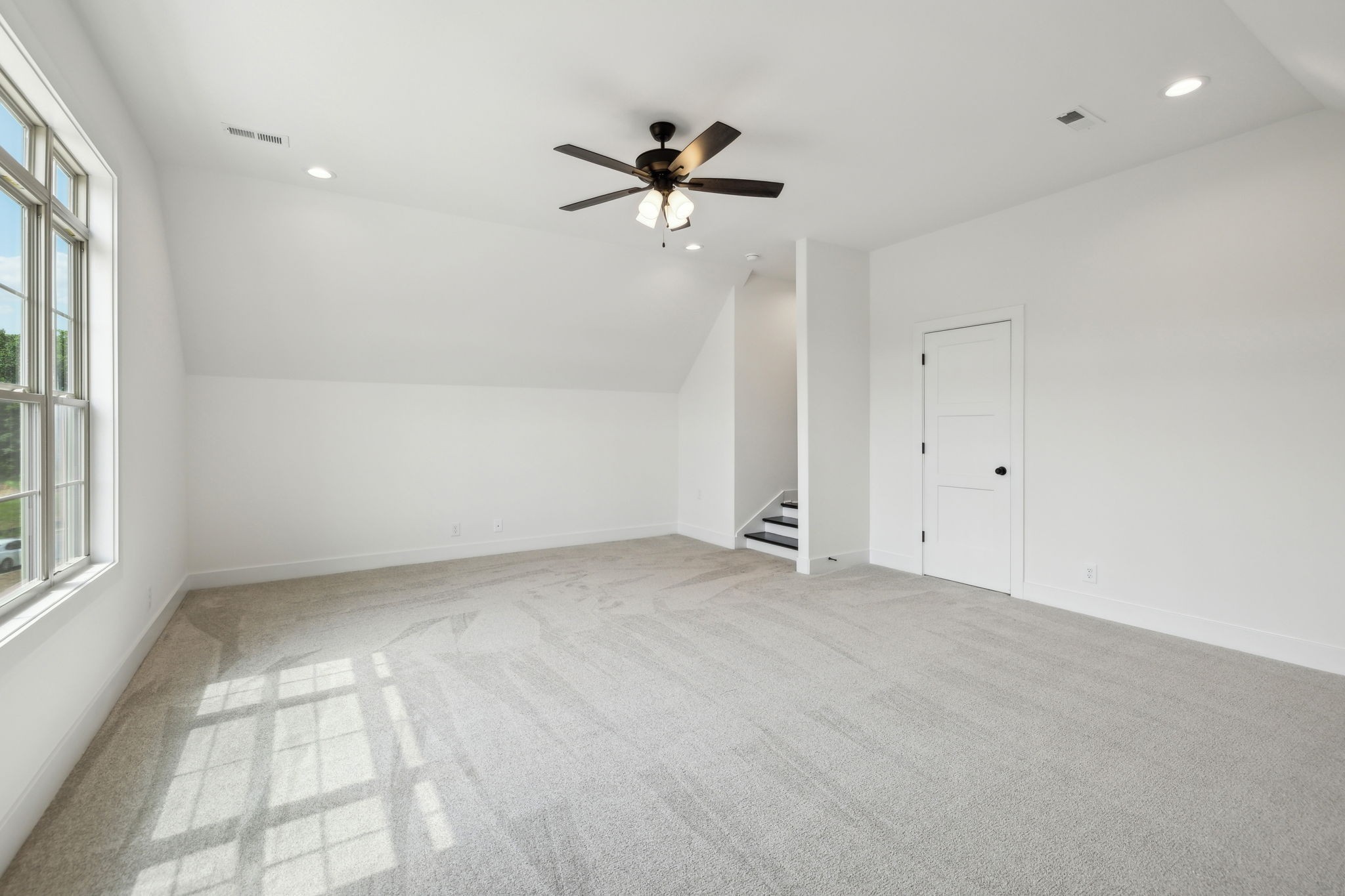 1075 Linder Ridge Road Indian Mound, TN 37079 - Photo 25 of 29 an empty room with a window and a fan