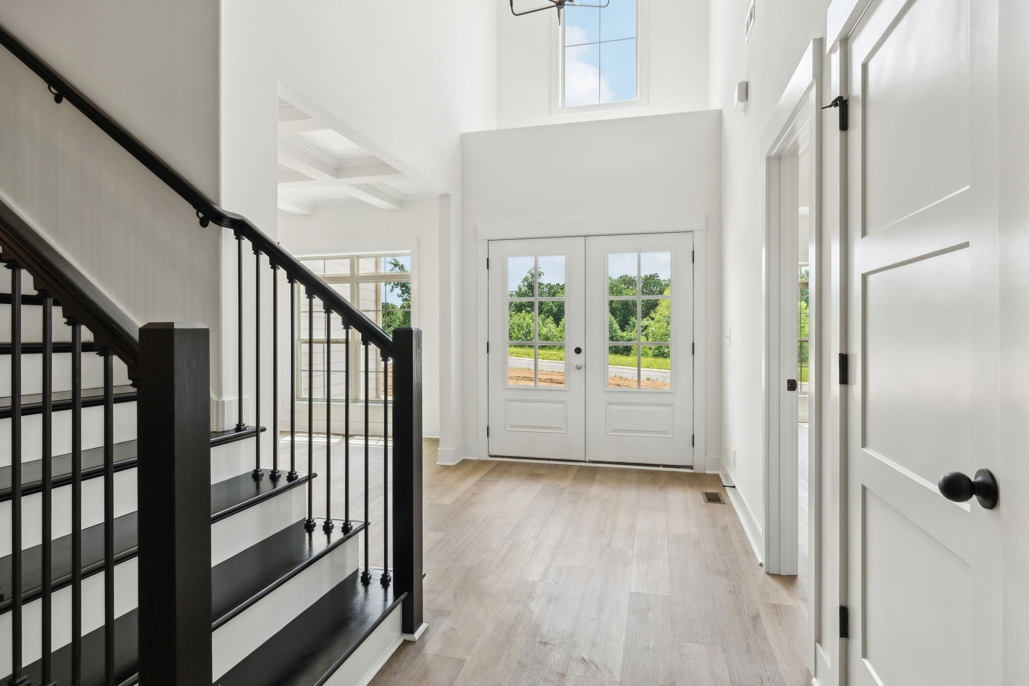 1075 Linder Ridge Road Indian Mound, TN 37079 - Photo 5 of 29 a view of a hallway with wooden floor and staircase