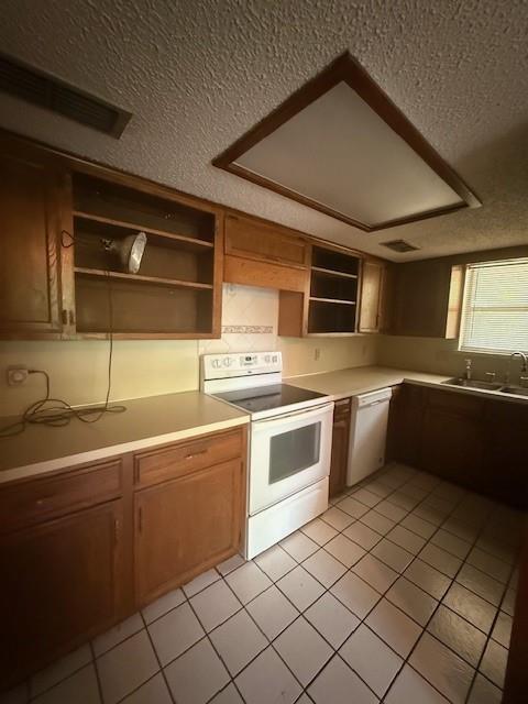 8761 South County Road Frisco, TX 75034 - Photo 5 of 19 a kitchen with stainless steel appliances a sink stove and cabinets