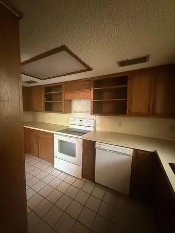 a kitchen with a stove and a microwave