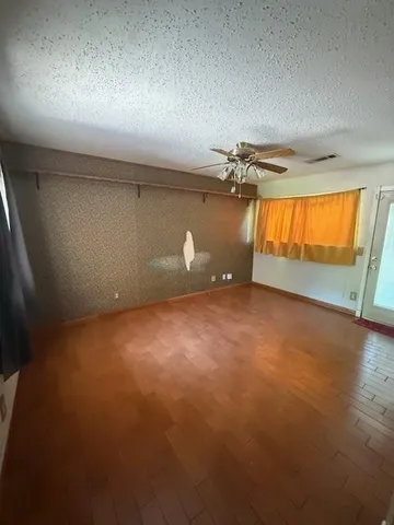 an empty room with a empty space and windows