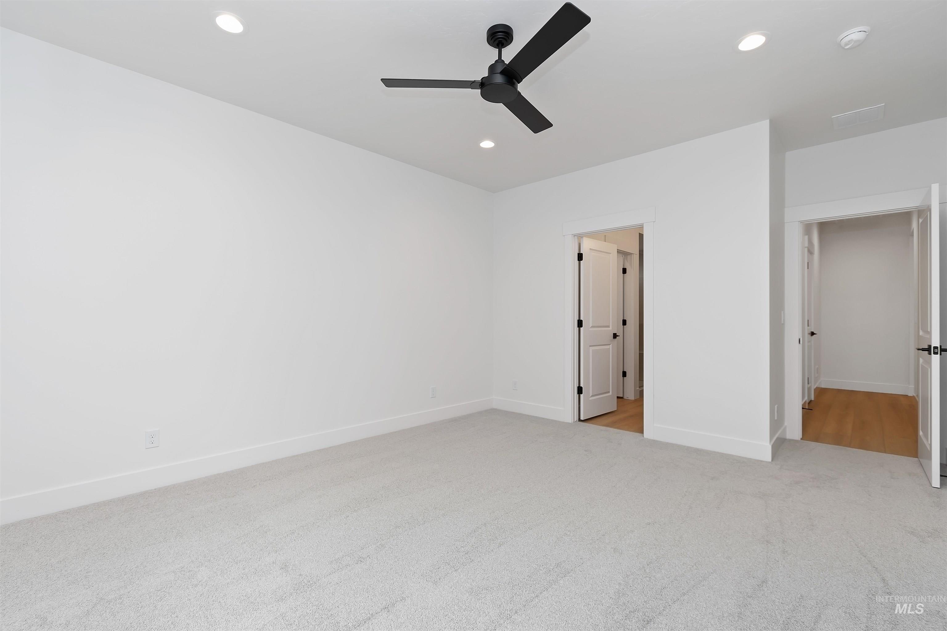 4302 Tropic Way Caldwell, ID 83607 - Photo 21 of 32 Unfurnished bedroom featuring light colored carpet, ceiling fan, and recessed lighting