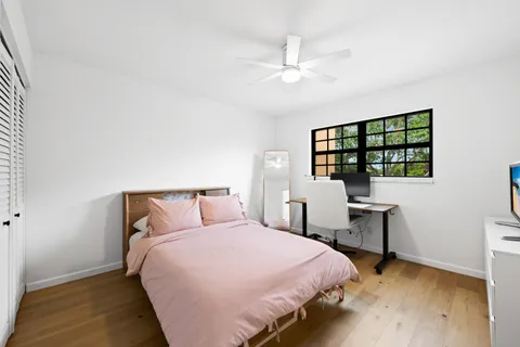 a bedroom with a bed and a table in it