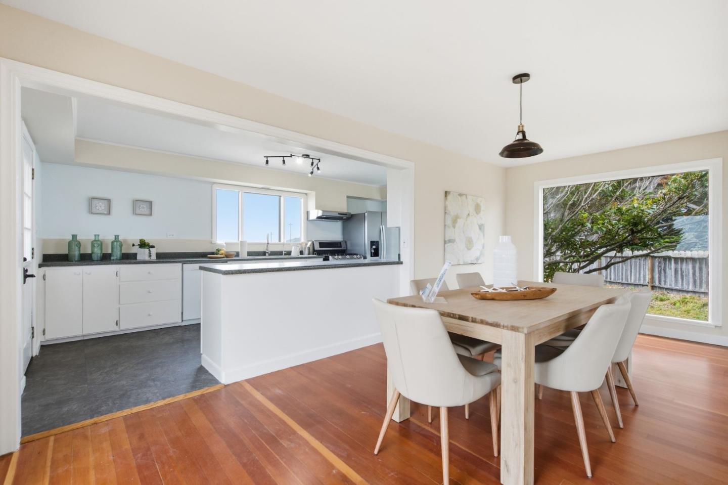 1263 Reservoir Road Pescadero, CA 94060 - Photo 25 of 66 a kitchen with a table and chairs in it