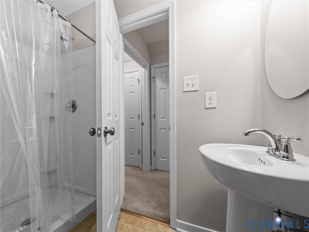 10824 Avening Road Chesterfield, VA 23832 - Photo 38 of 47 a bathroom with a sink and a mirror