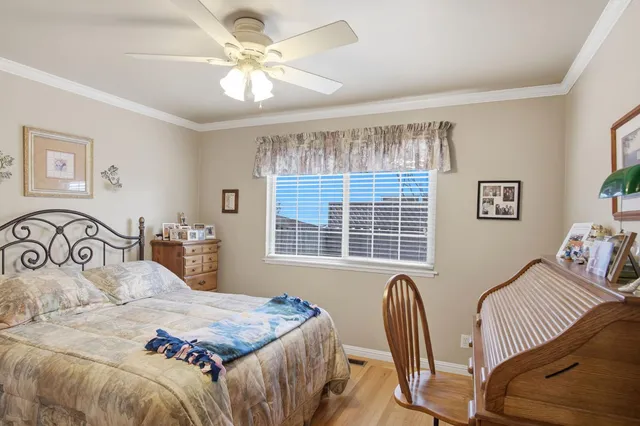 a bedroom with a bed and a table with chair