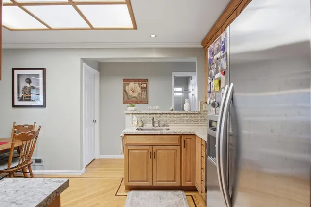 a view of a livingroom with furniture and a window