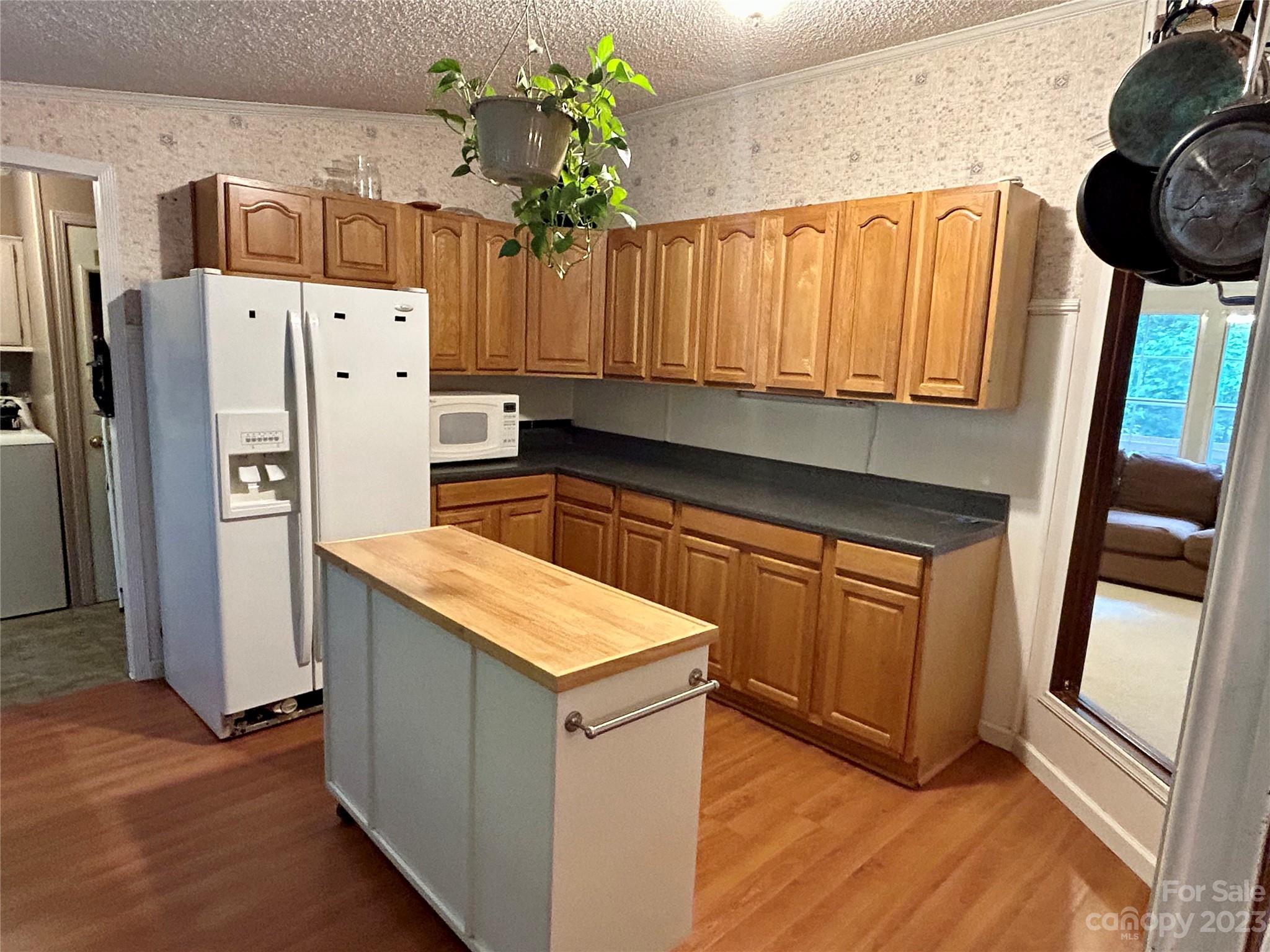 71 Bear Trail Fairview, NC 28730 - Photo 16 of 42 a kitchen with a refrigerator and a stove