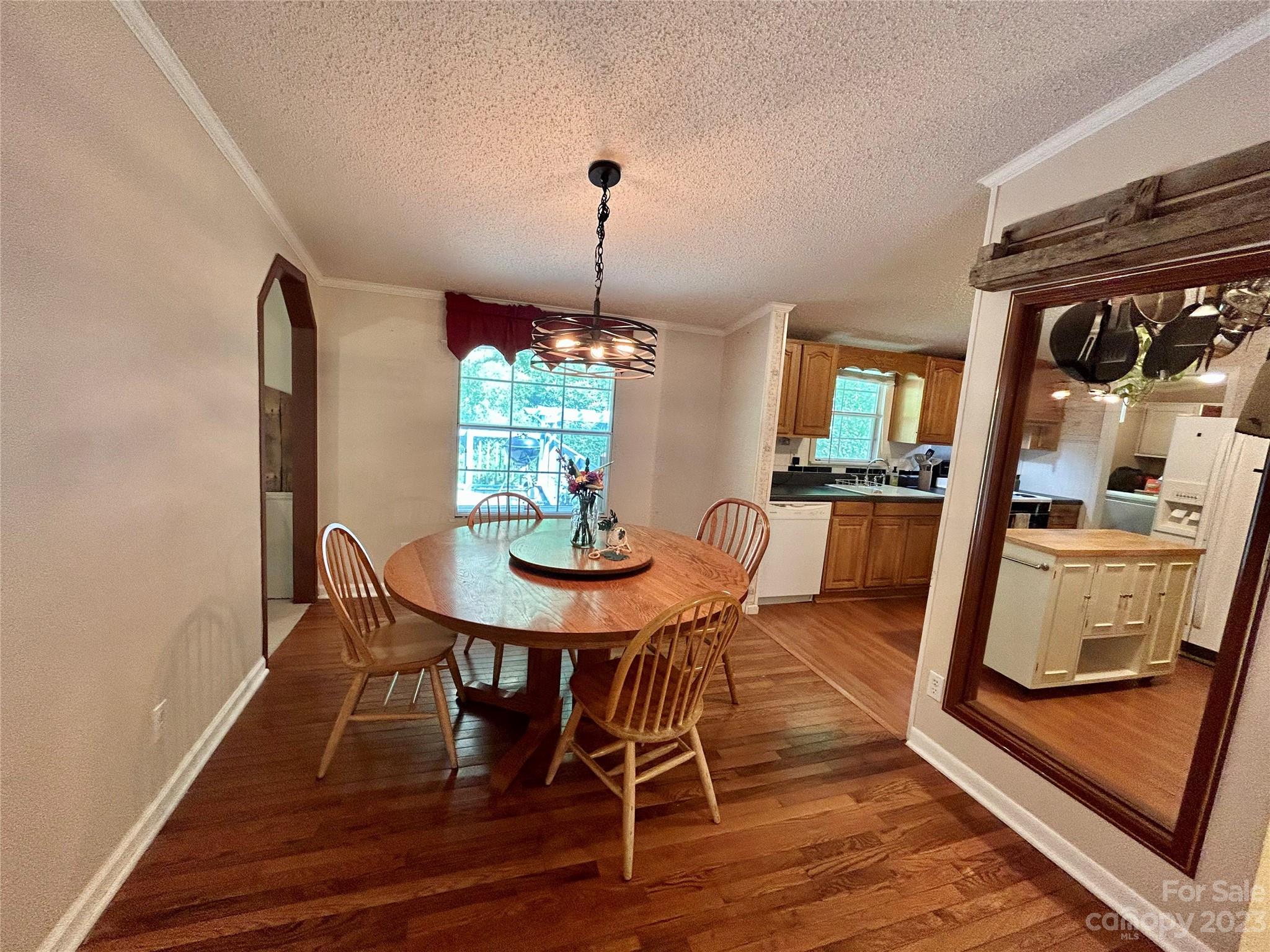 71 Bear Trail Fairview, NC 28730 - Photo 19 of 42 a view of a dining room with furniture and wooden floor