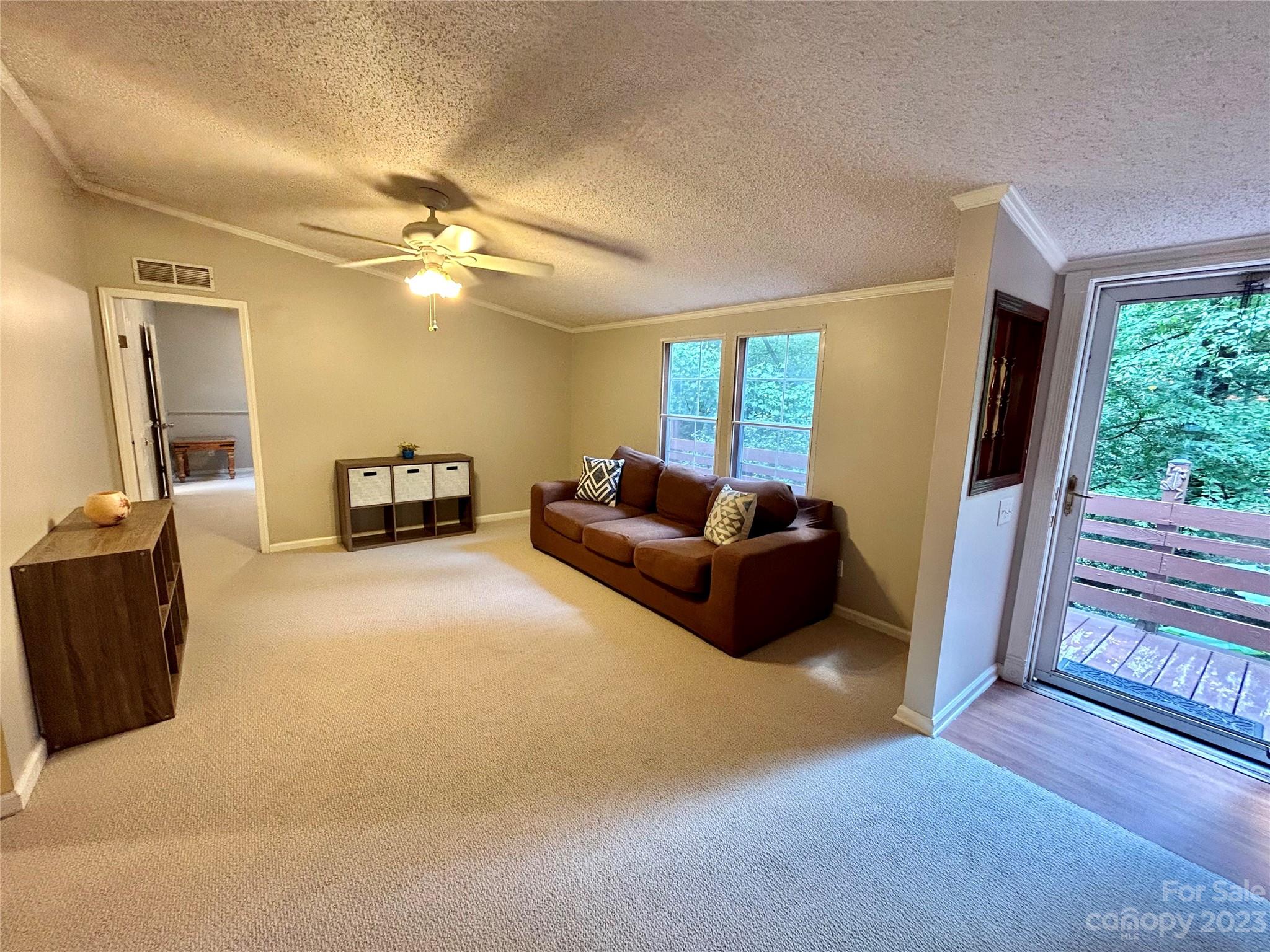 71 Bear Trail Fairview, NC 28730 - Photo 20 of 42 a living room with furniture and a flat screen tv