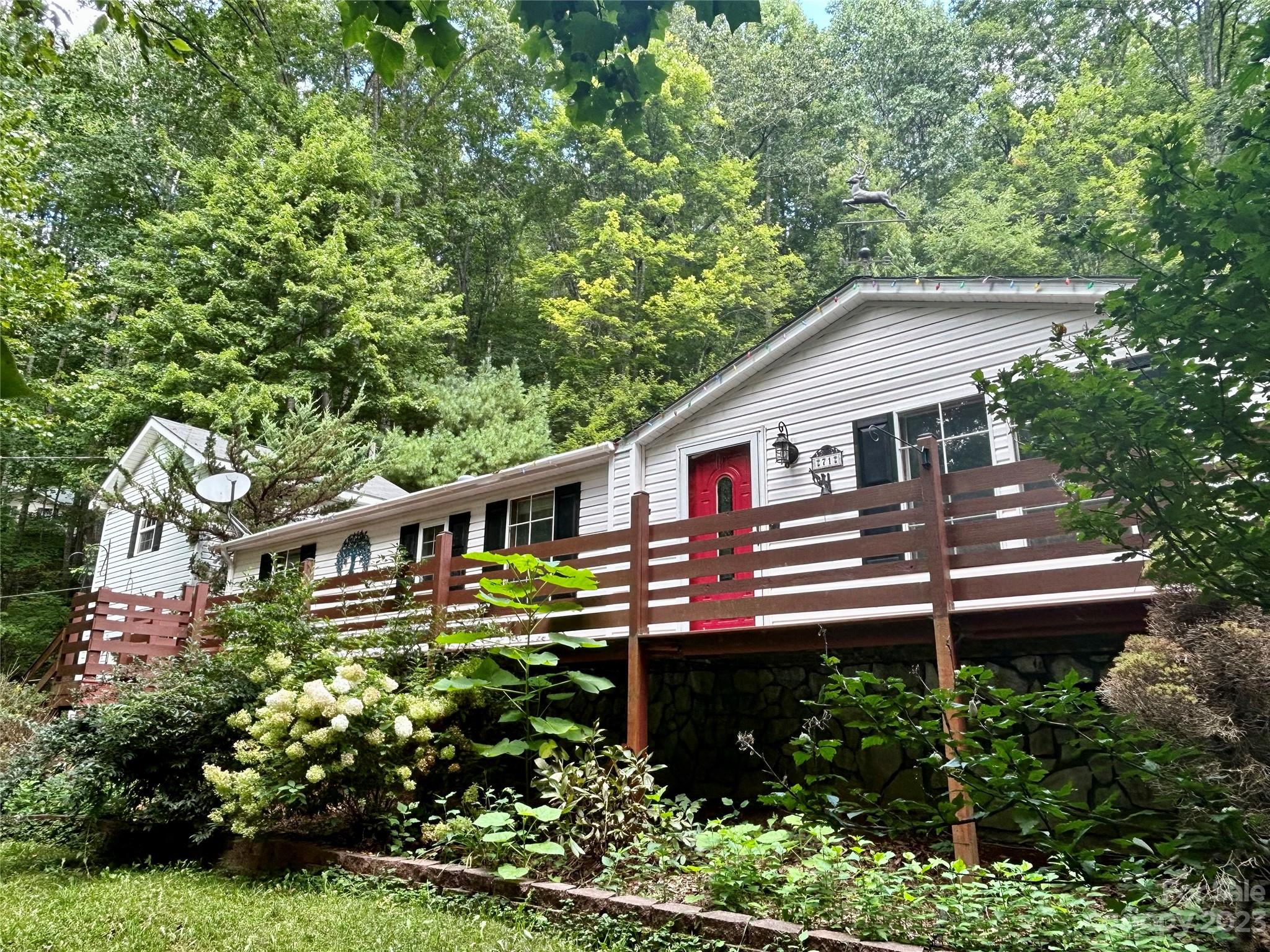 71 Bear Trail Fairview, NC 28730 - Photo 2 of 42 a front view of a house with a balcony