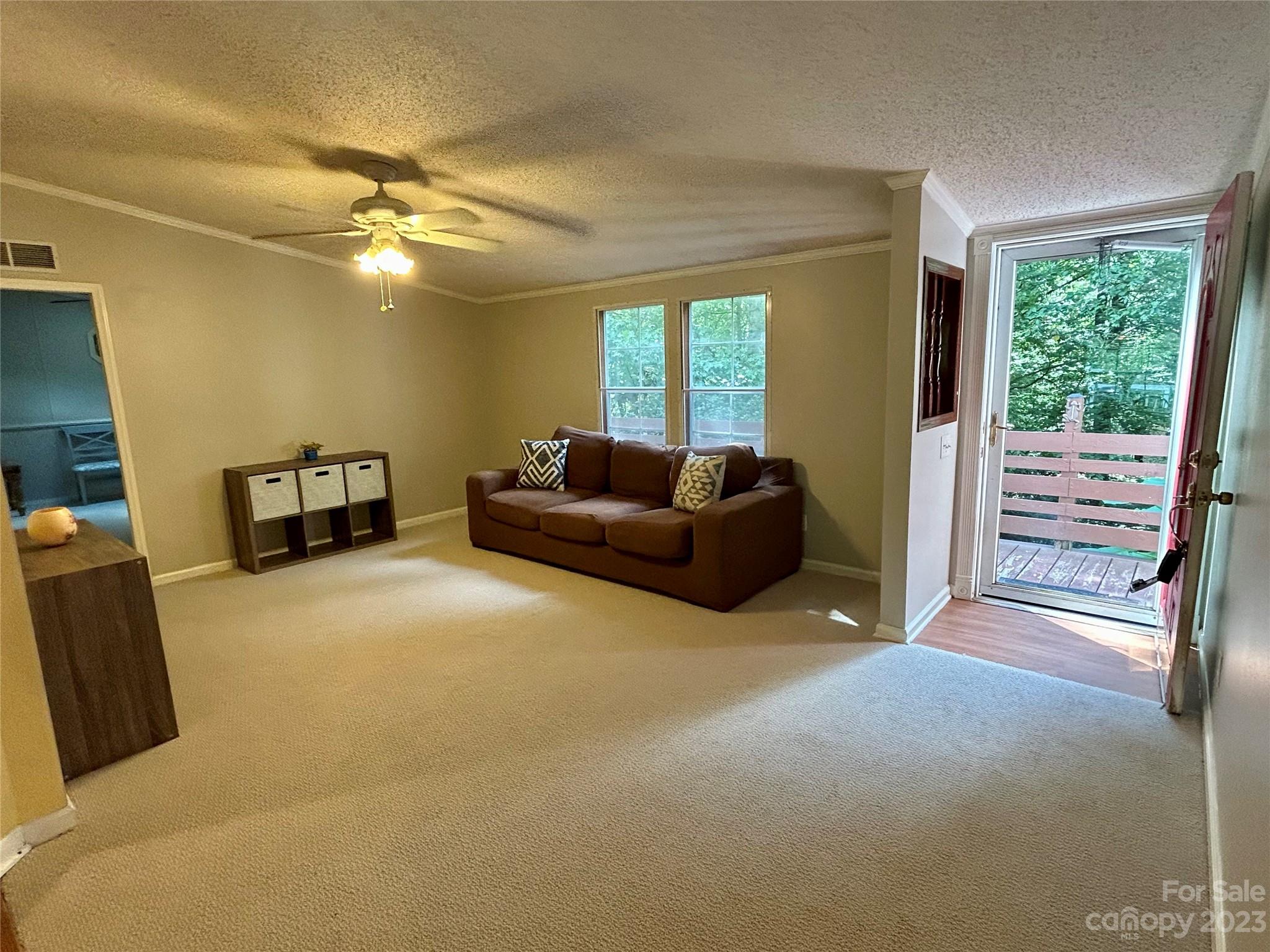 71 Bear Trail Fairview, NC 28730 - Photo 23 of 42 a living room with furniture and a large window