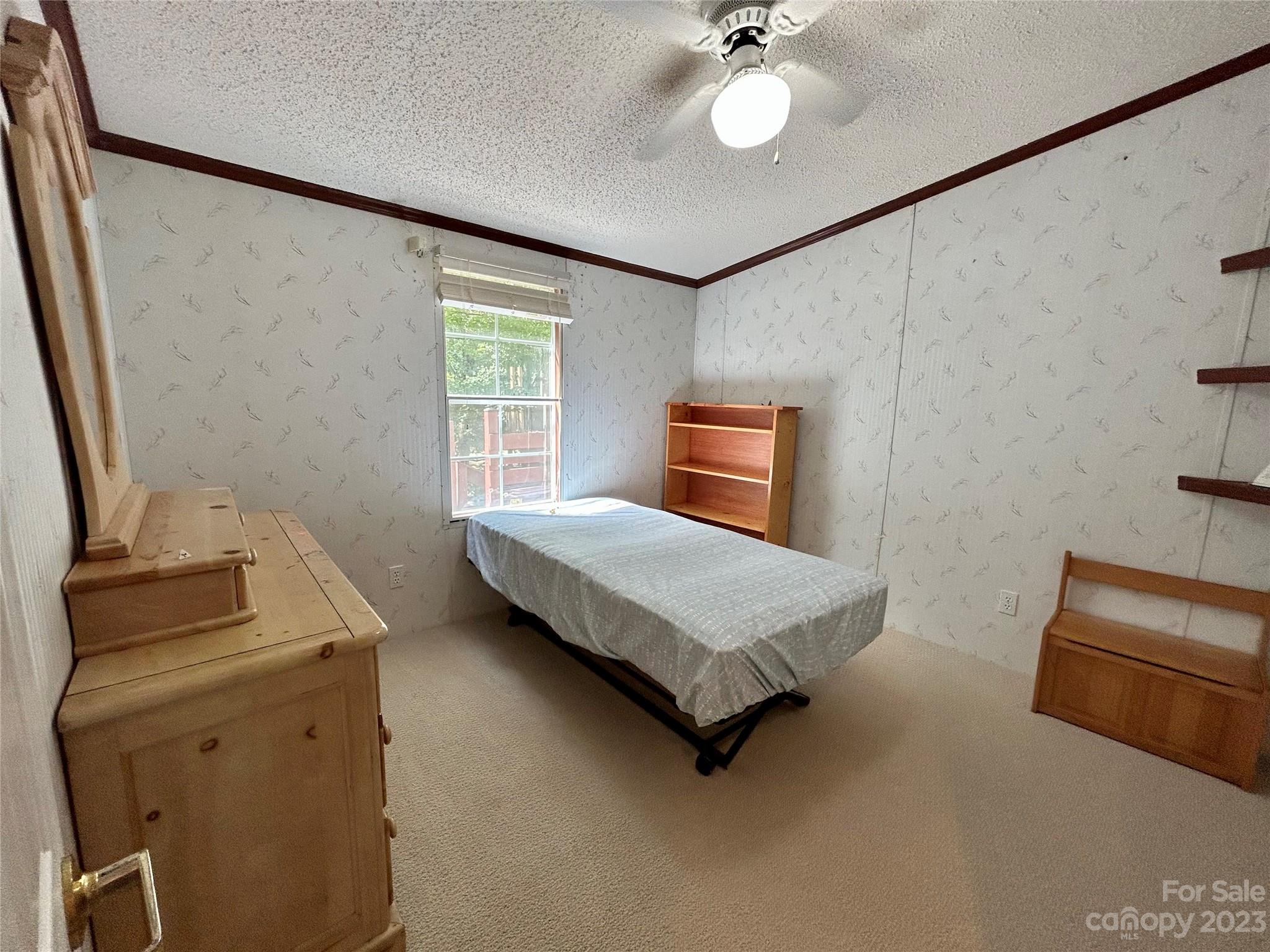 71 Bear Trail Fairview, NC 28730 - Photo 25 of 42 a bedroom with a bed and a couch