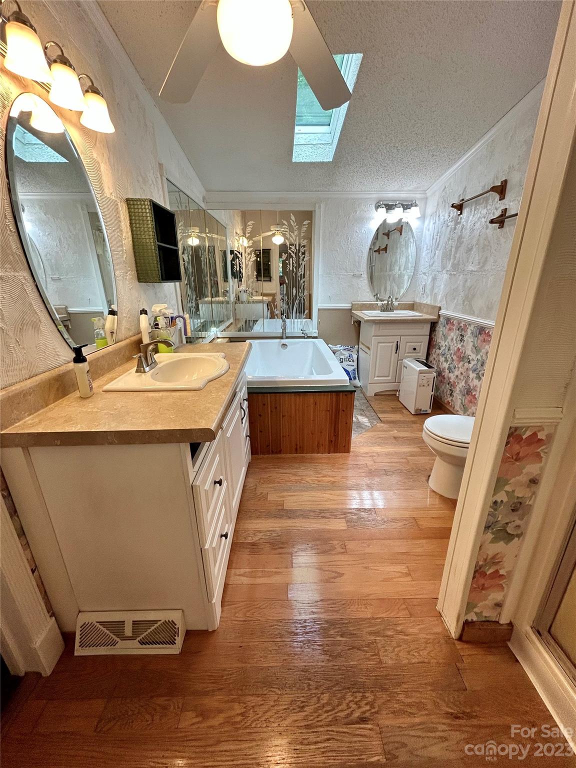 71 Bear Trail Fairview, NC 28730 - Photo 29 of 42 a spacious bathroom with a double vanity sink and a mirror