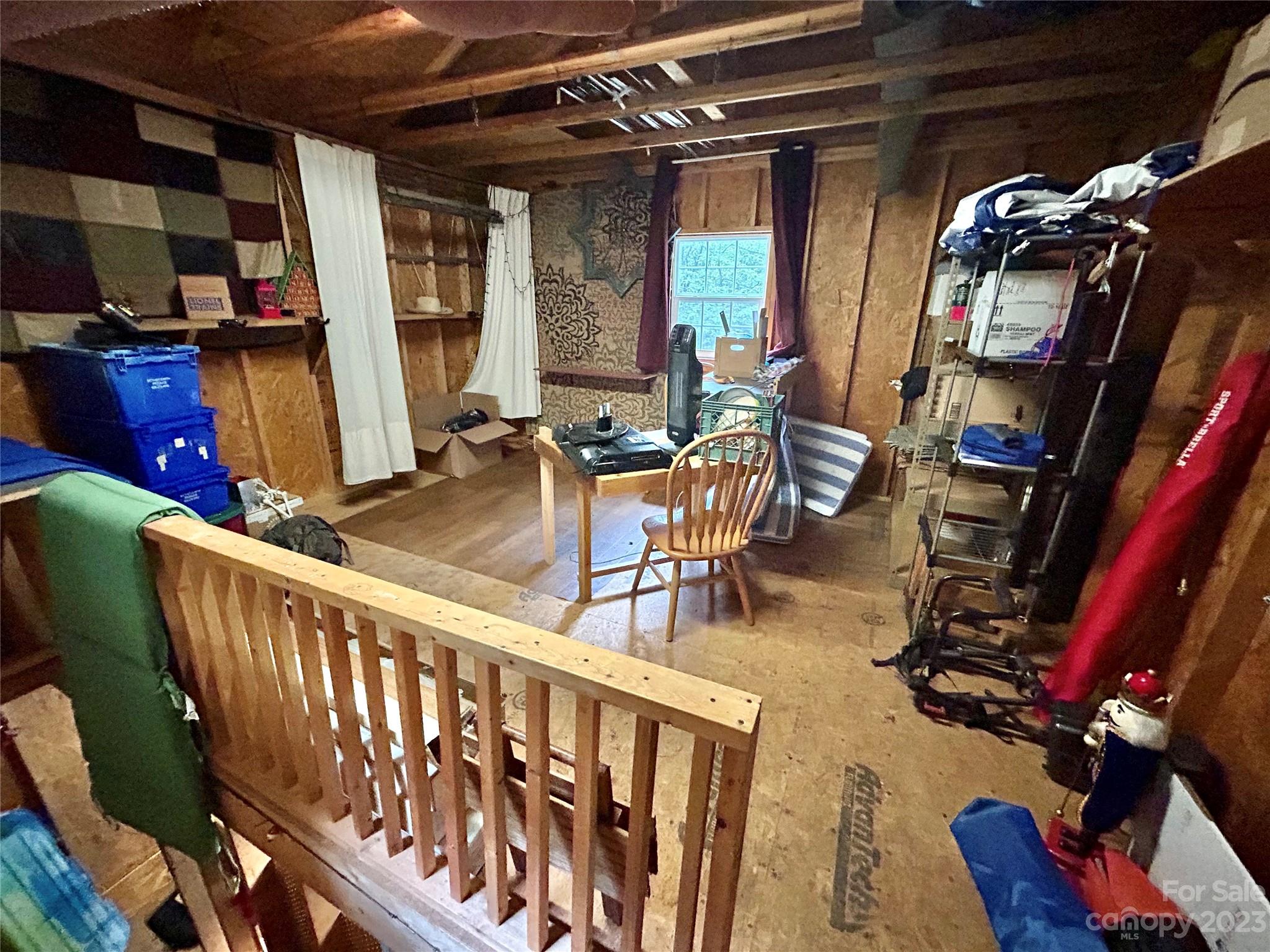 71 Bear Trail Fairview, NC 28730 - Photo 36 of 42 a view of a living room with furniture and clothes