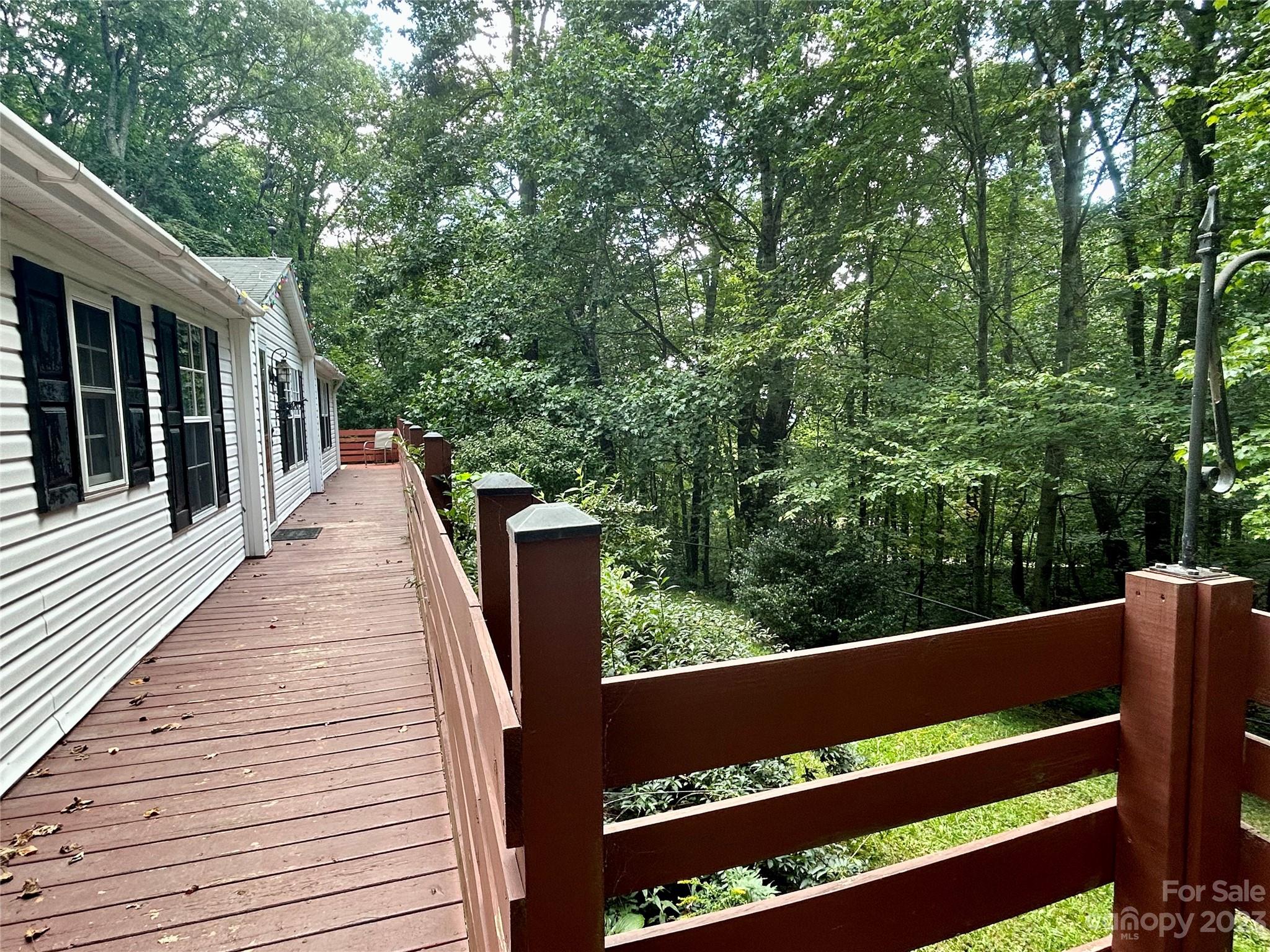 71 Bear Trail Fairview, NC 28730 - Photo 5 of 42 a view of balcony with wooden floor and fence